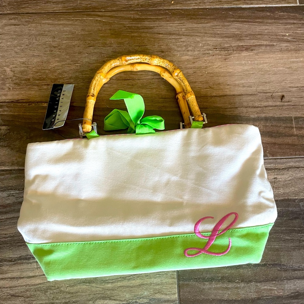 Braciano handbag with “L” on lower right. New with tags. Pink Checkered inside